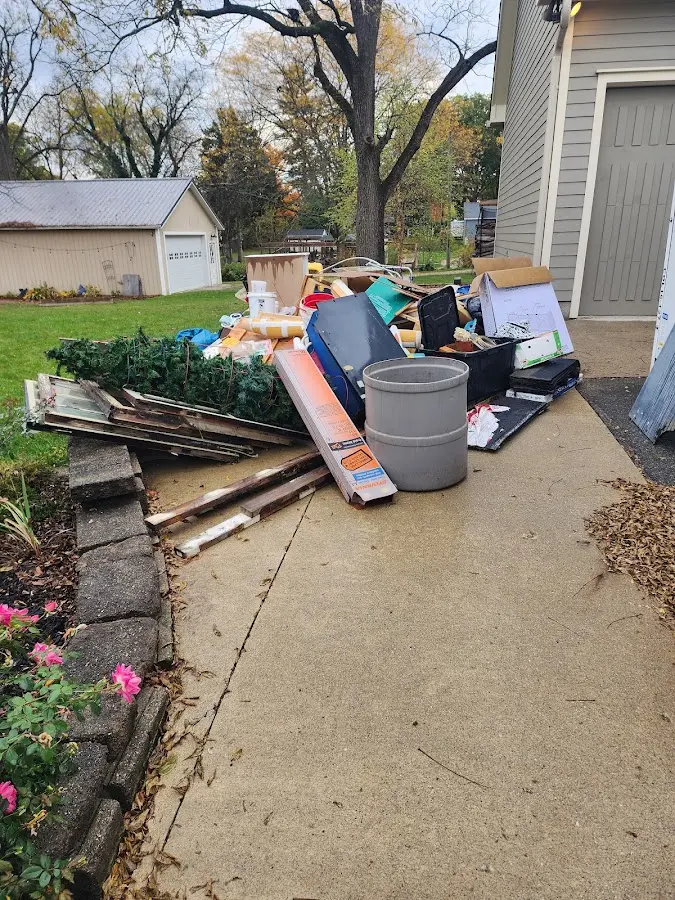 Dumpster being loaded with debris for 30 Yard Dumpster Rental in Franklin Lakes